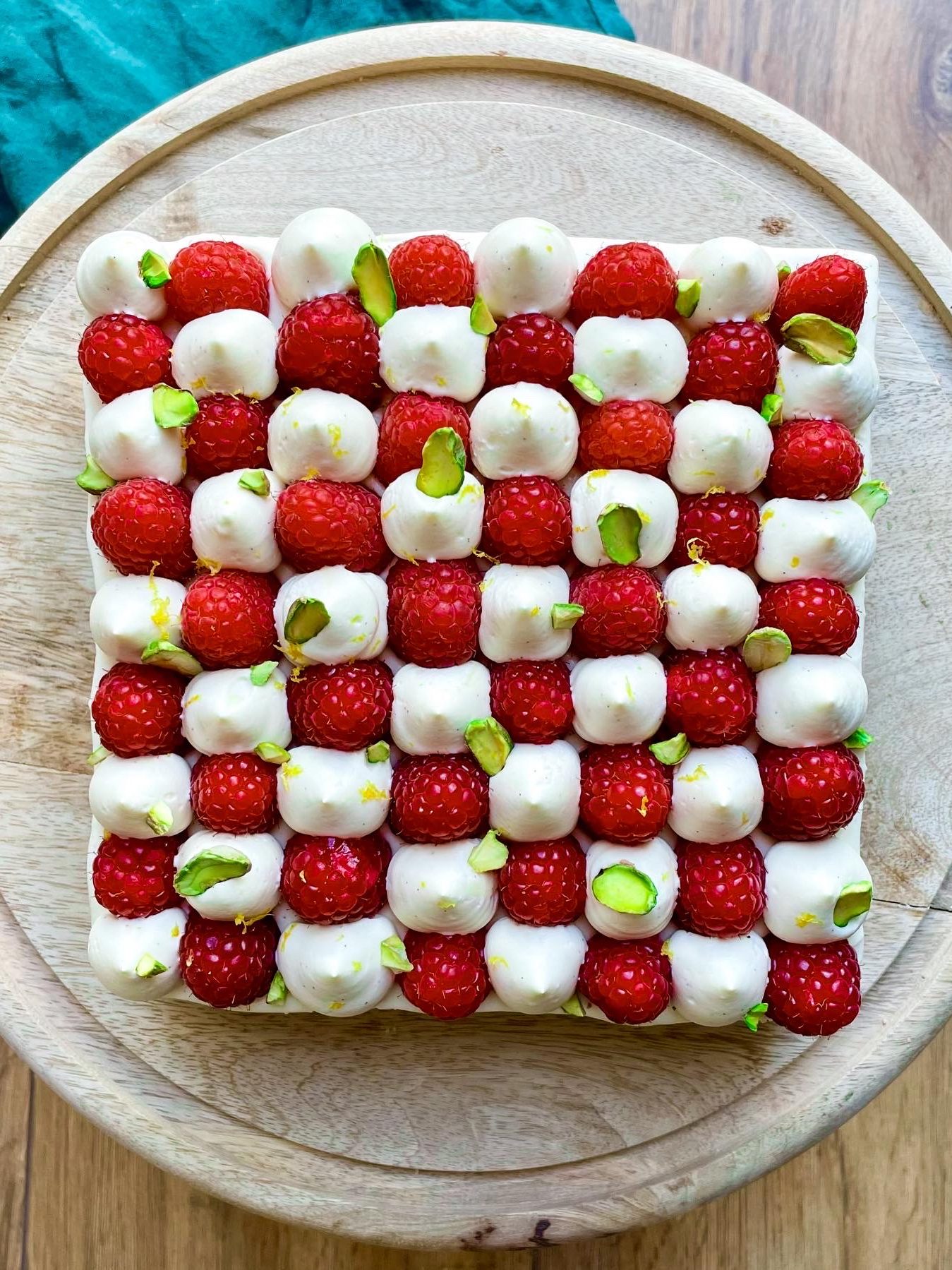 A checkerboard opera cake with raspberry and pistachio